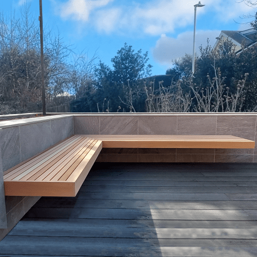 A garden corner bench in minimalist designed outdoor space.